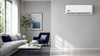 NG BLU+ Multi-Zone 24,000 BTU Wall-Mount Air Handler - 23.5 SEER2 - Wall-mounted indoor head in a modern living room